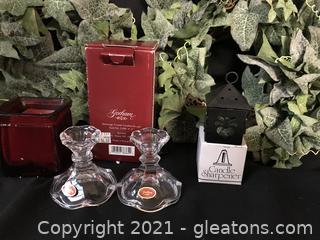 2 New in Box Gotham candle holders, 2 ivy candle rings, candle sharpener , green ball candles.