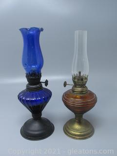 Two Decorative Oil Lamps - Cobalt Blue and Amber On Metal Base