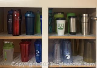Two Shelves with Coffee Mugs and Other Cups