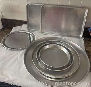 Eight Pieces of Metal Baking and Serving Ware