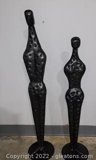 Pair of Contemporary Male and Female Hammered Metal Statues
