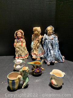 Three Antique Dolls and Four Miniature Pitchers  