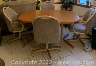 Mid Century Dining Table with Four Chairs on Wheels 