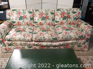 Glamorous Skirted Sofa with Cloth Floral Upholstery and Rolled Arms from J.Royale Furniture in Hickory,NC 