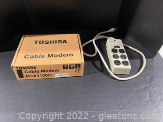 Toshiba Modem and a Power Strip (Lot of 2)