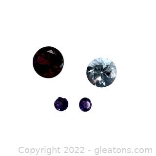 4 Loose Gemstones (Garnet, Sky Blue Topaz and Amethyst)