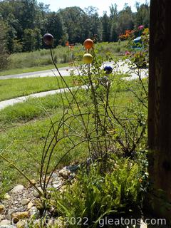 Whimsical Garden Art Topped w/Ceramic Spheres in Front Porch Flower Bed