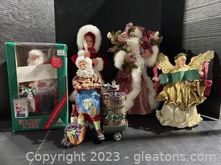 Mixed Holiday Figures : Santas, an Angel and a Female Caroler 