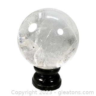 Clear Quartz Gemstone Sphere on Black Base