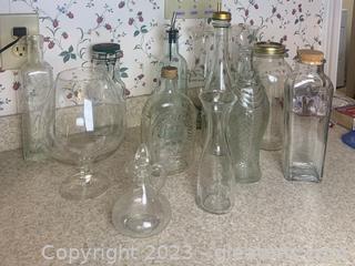 Collection of Bottles and Glass Items Including A Vintage Log Cabin Syrup