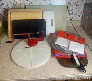 Kitchen Prep Items Including a Large Glass Cutting Board and an Apple Peeler