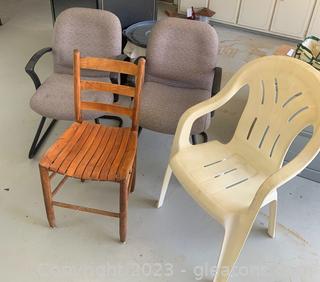 Four Different Styled Chairs Including A Vintage Wooden Chair