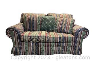 Multicolored Striped Rolled Arm Skirted Loveseat