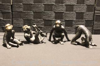 Four Cast Iron Unique Monkey Figurines 
