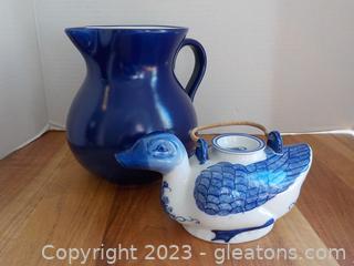 Large Ceramic Pitcher and a Duck Shaped Teapot