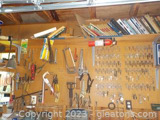 Pegboard Full of Various Handtools and Keys