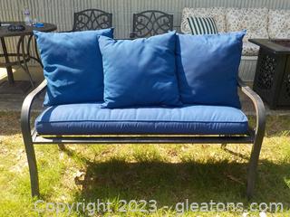 Sturdy Metal Outdoor Bench with Hummingbird/Floral Back; has Navy Cushion and 3 Navy Throw Pillows