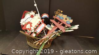 Lot Of Christmas Decor Yards Sticks, Wall Hanger, Stuffed Santa And Nice Gold Wire Basket/Wire Sleigh