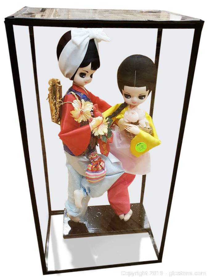 oriental dolls in glass cases