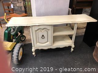 Small Rolling Buffet/Server On Caster Wheels With Folding Ends Beautiful Pale Yellow With Gold Accent