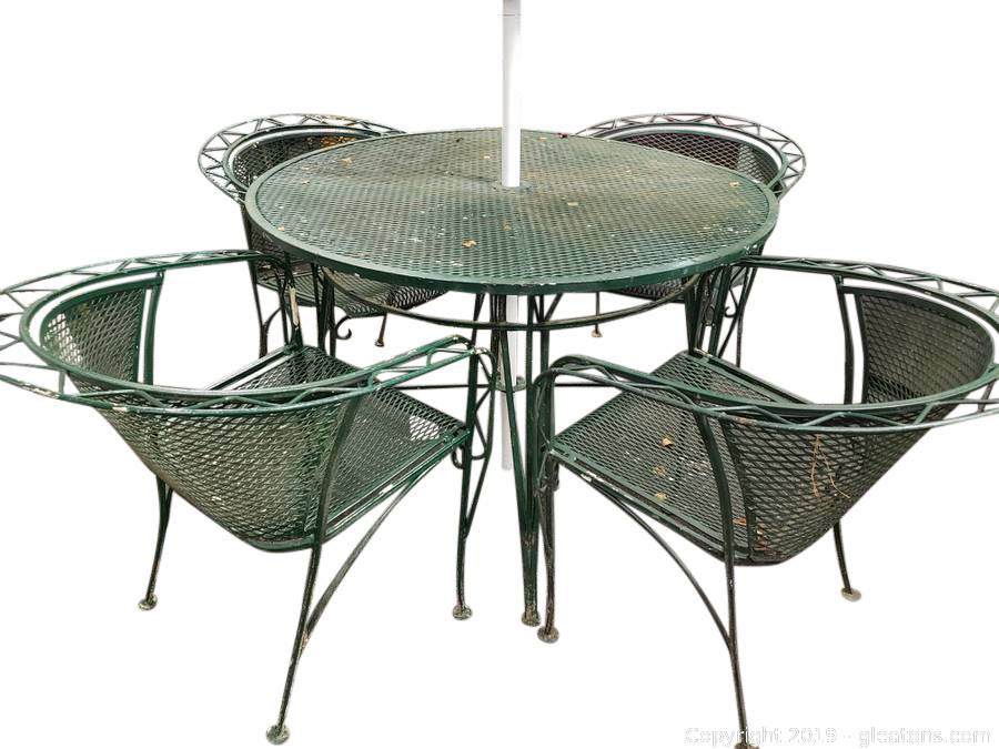 round wrought iron table and 4 chairs