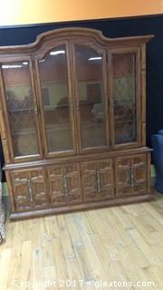 VINTAGE CHAINA CABINET WITH WIRE DESIGN ON FRONT AND GLASS SHELVES AND DOORS BELOW WITH DRAWER BEHIND THEM
