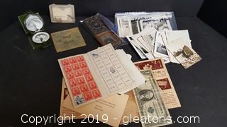 US savings bond stamps, African American photos from the 1930s and 1940s and an Army compass